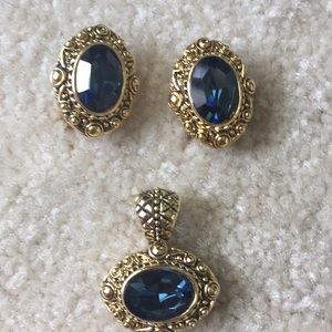 Goldtone and blue earrings and pendant set.